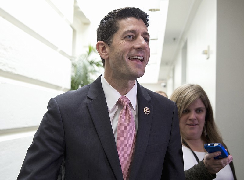 Rep. Paul Ryan, R-Wis., walks from a House GOP candidate forum on Capitol Hill in Washington, Wednesday, Oct. 28, 2015. The House is poised to vote on a bipartisan pact charting a two-year budget truce and Republicans are set to nominate Ryan as the chamber's new speaker, milestones GOP leaders hope will transform their party's recent chaos into calm in time for next year's presidential and congressional campaigns. (AP Photo/Carolyn Kaster)