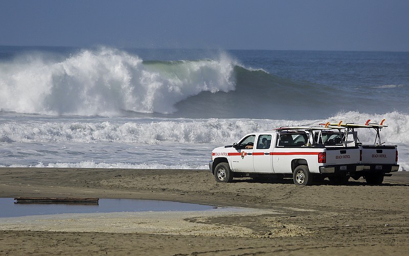 The beach patrol with the National Park Service watches over the high surf at Ocean Beach, Wednesday, Oct. 28, 2015, in San Francisco. There have been no reports so far of coastal flooding as high tides and an arriving swell from a Pacific storm produced big surf along the central and Southern California coast. 