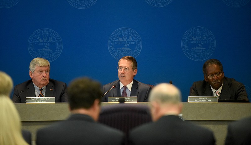 State Sens. Randy McNally, Bo Watson and Reginald Tate, from left, hold a legislative hearing at the Hamilton County Department of Education in Chattanooga, Tenn., on Thursday, October 29, 2015. State Sen. Bo Watson held the meeting to discuss state incentives used for Volkswagen's Chattanooga plant expansion.