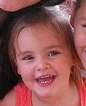 This photo provided by Knoxville Police Department shows Brooklynne Emerie Enix. The Tennessee Bureau of Investigation issued an Amber Alert on Wednesday, Oct. 28, 2015 for Brooklynne Emerie Enix, who they think is with her father Tyler Ward Enix. Police issued a warrant charging Tyler Ward Enix with murder of the girl's mother Kimberly Enix.