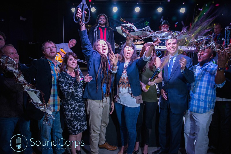 Among those celebrating the creation of SoundCorps, a nonprofit started to promote the music business in town, are app-developer Jonathan Susman, second from left, Track 29 and Revelry Room owner Monica Kinsey, SoundCorps Executive Director Stratton Tingle, and Chattanooga Mayor Andy Berke, second from right.