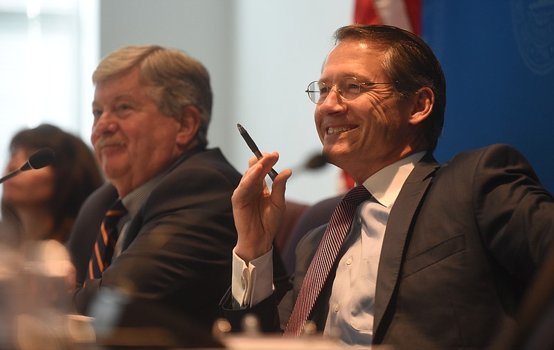 State Sens. Bo Watson, right, and Randy McNally are all smiles as they hear from Volkswagen representatives during a special legislative hearing on the state's incentives to the carmaker in Chattanooga Thursday.