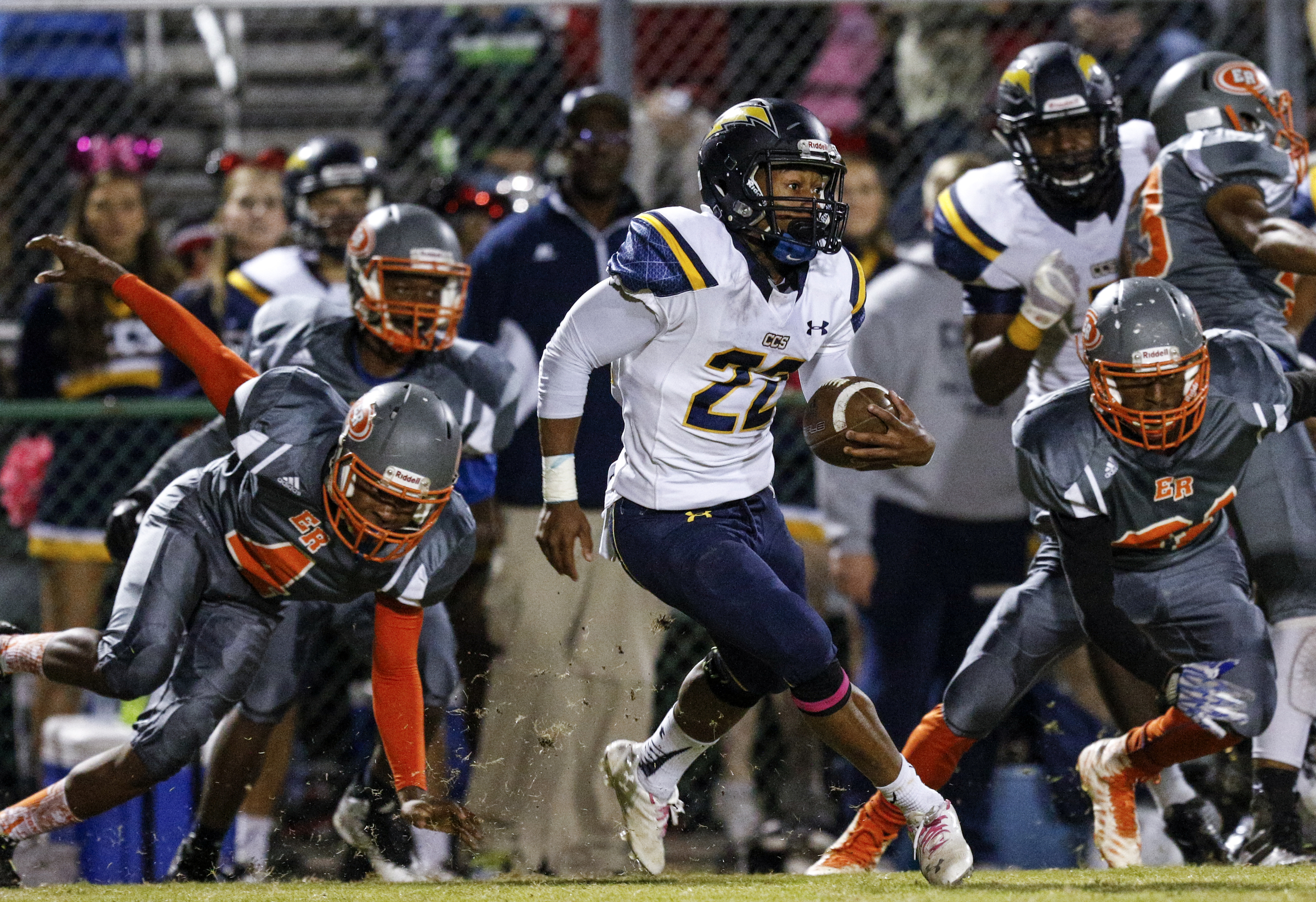 CCS running back T.J. Smith breaks through the East Ridge defensive line during their prep football game at East Ridge High School on Friday, Oct. 30, 2015, in East Ridge, Tenn.