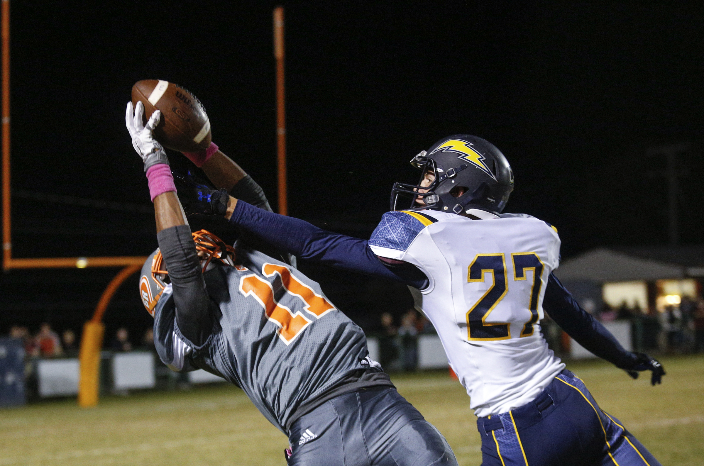 CCS defender Will Patton (27) breaks up a pass intended for East Ridge receiver Jesse Jones during their prep football game at East Ridge High School on Friday, Oct. 30, 2015, in East Ridge, Tenn.