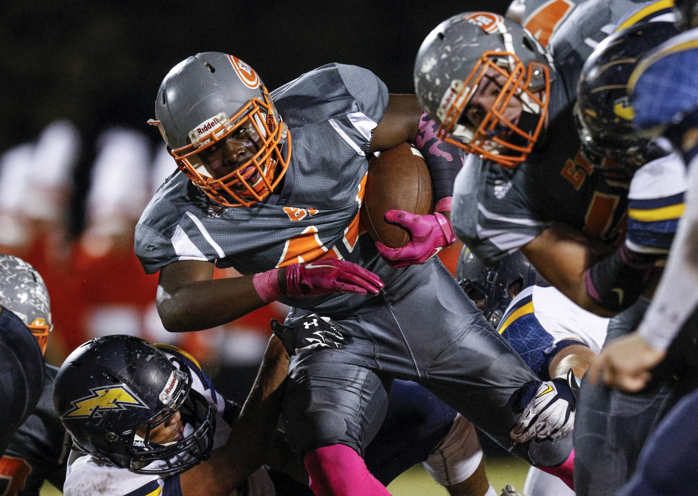 East Ridge running back Lorenzo Stewart struggles for yardage against CCS defenders during their prep football game at East Ridge High School on Friday, Oct. 30, 2015, in East Ridge, Tenn.