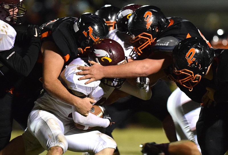 Grace's Alex Blandon (33) is gang tackled by a host of Pirates.  Grace Baptist Academy visited South Pittsburg in aTSSAA football game on Friday, October 16, 2015.