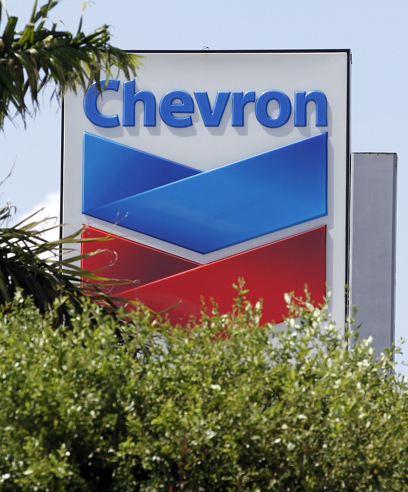 
              FILE - This Aug. 20, 2012 photo shows a Chevron sign in Miami. Chevron Corp. is cutting up to 7,000 jobs as it deals with lower oil prices that are cutting deeply into profit. The company said Friday, Oct. 30, 2015  that it would cut capital and exploratory spending next year by one-fourth, with further cuts in 2017 and 2018 depending on the oil industry's condition then.  (AP Photo/Alan Diaz)
            