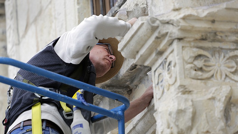 
              Ivan Myjer, a stone conservator based in suburban Boston who has helped restore historic sites around the world. make repairs to the Alamo, Thursday, Oct. 29, 2015, in San Antonio. The Alamo is undergoing $5 million in emergency repairs, part of a sweeping, state Legislature-approved $31.5 million makeover that may be one of the site’s most-ambitious since the days of Davy Crockett. (AP Photo/Eric Gay)
            