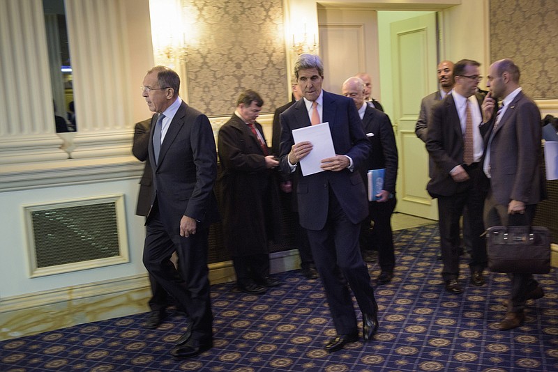 Russian Foreign Minister Sergei Lavrov and Secretary of State John Kerry arrive for a news conference in Vienna, Austria, Friday, Oct. 30, 2015. The U.S., Russia and more than a dozen other nations have directed the U.N. to begin a new diplomatic process with Syria's government and opposition with the goal of reaching a nationwide cease-fire and political transition. 