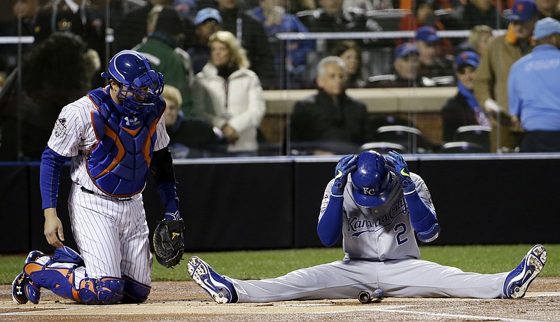 
              Kansas City Royals' Alcides Escobar reacts after nearly hit by a pitch during the first inning of Game 3 of the Major League Baseball World Series against the New York Mets Friday, Oct. 30, 2015, in New York. (AP Photo/David J. Phillip)
            