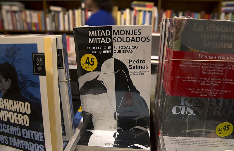 
              The book Half Monks, Half Soldiers stands for sale at a bookstore in Lima, Peru, Saturday, Oct. 31, 2015. A secretive Roman Catholic society with chapters across South America and in the U.S., called Sodalitium Christianae Vitae, or Sodalitium of Christian Life, has revealed under pressure that the Vatican has named an investigator to look into allegations that its founder sexually molested young recruits. This week, Sodalitium's general secretary disclosed the Vatican investigation after two journalists published a book detailing the accusations against founder Luis Fernando Figari. (AP Photo/Martin Mejia)
            