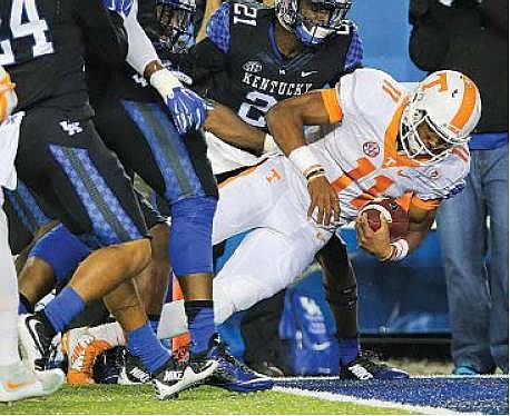 Tennessee quarterback Josh Dobbs falls in the end zone for a touchdown against Kentucky on Saturday in Lexington, Ky. (THE ASSOCIATED PRESS)