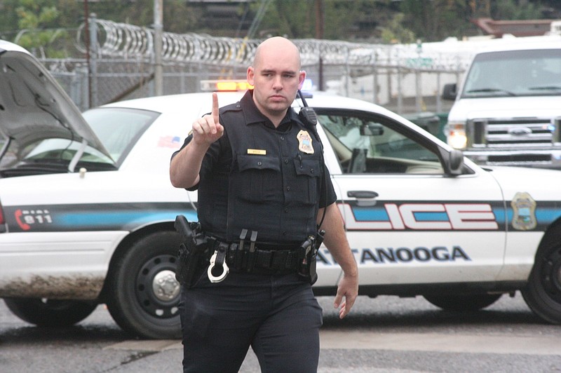 Chattanooga Police Officer Brock at the scene of a homicide this morning on Olive Street.