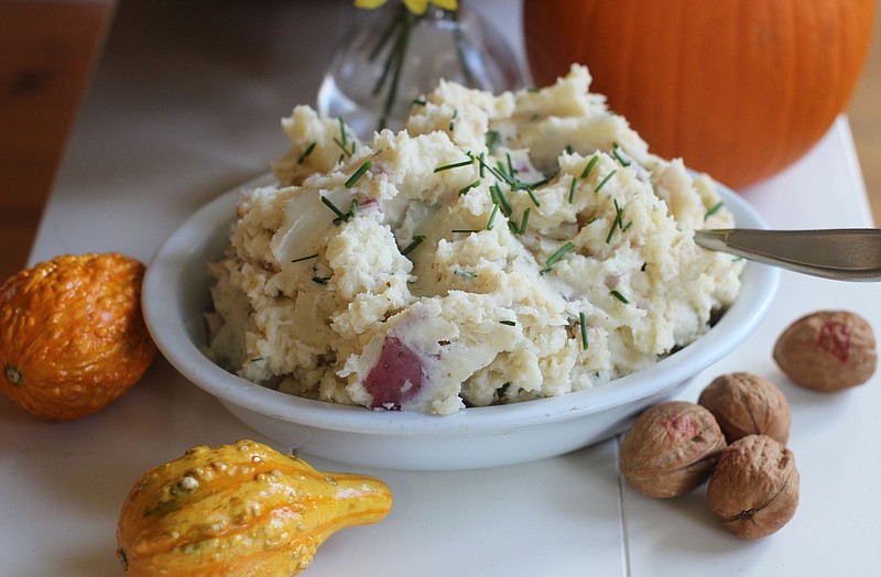 This Oct. 5, 2015 photo shows deviled mashed potatoes in Concord, NH. We started by creating a master recipe for basic, buttery-creamy mashed potatoes that are delicious just as they are. We also offer you six ways to jazz up our basic recipe. (AP Photo/Matthew Mead)