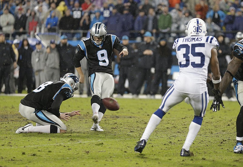 Carolina Panthers' Graham Gano (9) kicks the game-winning field goal in overtime against the Indianapolis Colts in an NFL football game in Charlotte, N.C., early Tuesday, Nov. 3, 2015. The Panthers won 29-26.