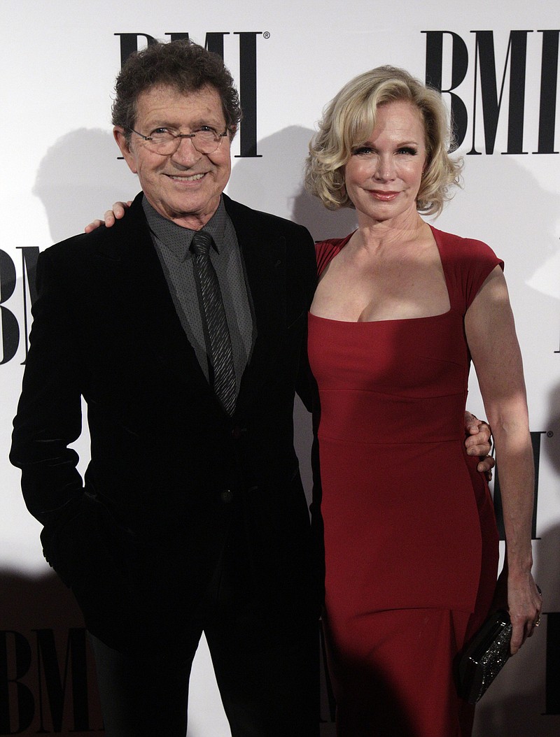 
              Mac Davis and his wife Lise Kristen Gerard is seen at the 63rd Annual BMI Country Awards at BMI's Music Row offices on Tuesday, Nov. 3, 2015, in Nashville, Tenn. (Photo by Wade Payne/Invision/AP)
            