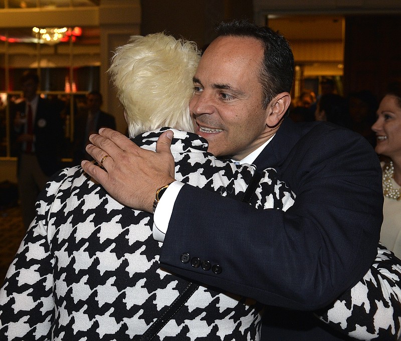 Kentucky Republican gubernatorial candidate Matt Bevin, right, hugs one of his supporters at the Republican Party celebration Tuesday, Nov. 3, 2015, in Louisville, Ky.