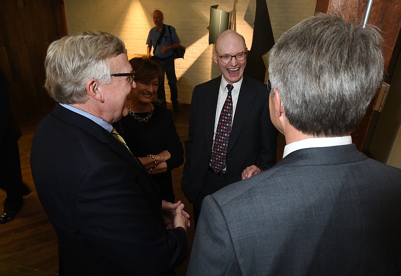 Wehco Media Chairman Walter Hussman, center, stands with his wife, Ben, second from left, and discusses the new Arts Building with ArtsBuild Executive Director Dan Bowers, left, and ArtsBuild board chairman Lee Davis.