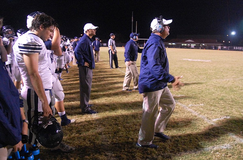 Gordon Lee head coach Greg Ellis (far right) reacts to a play in the second quarter.  The Gordon Lee Trojans visited the Dade County Wolverines in GHSA football action Thursday night, November 5, 2015.