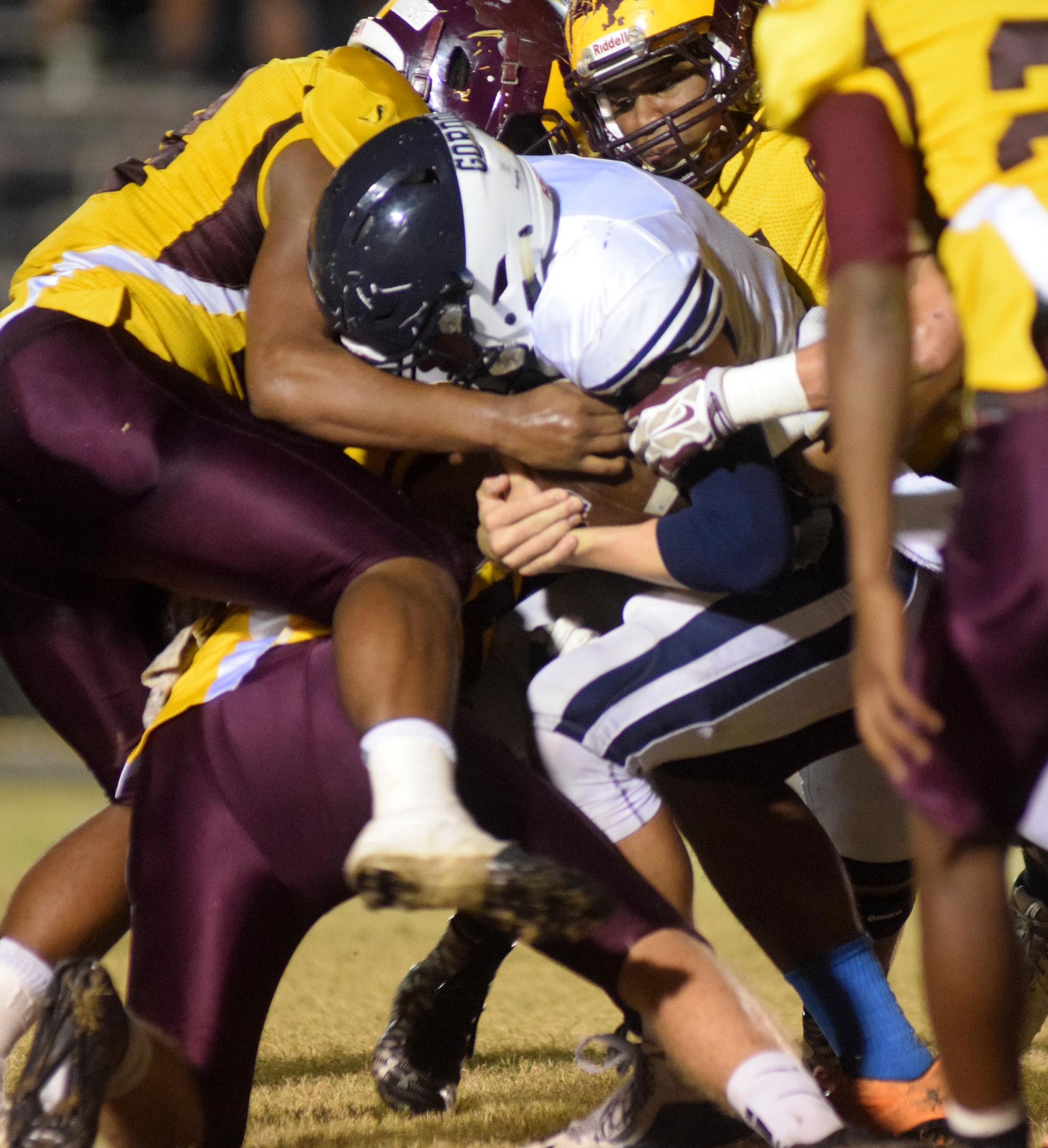 Gordon Lee quarterback Caleb O'Neal (10) is gang tackled by Dade County.  The Gordon Lee Trojans visited the Dade County Wolverines in GHSA football action Thursday night, November 5, 2015.