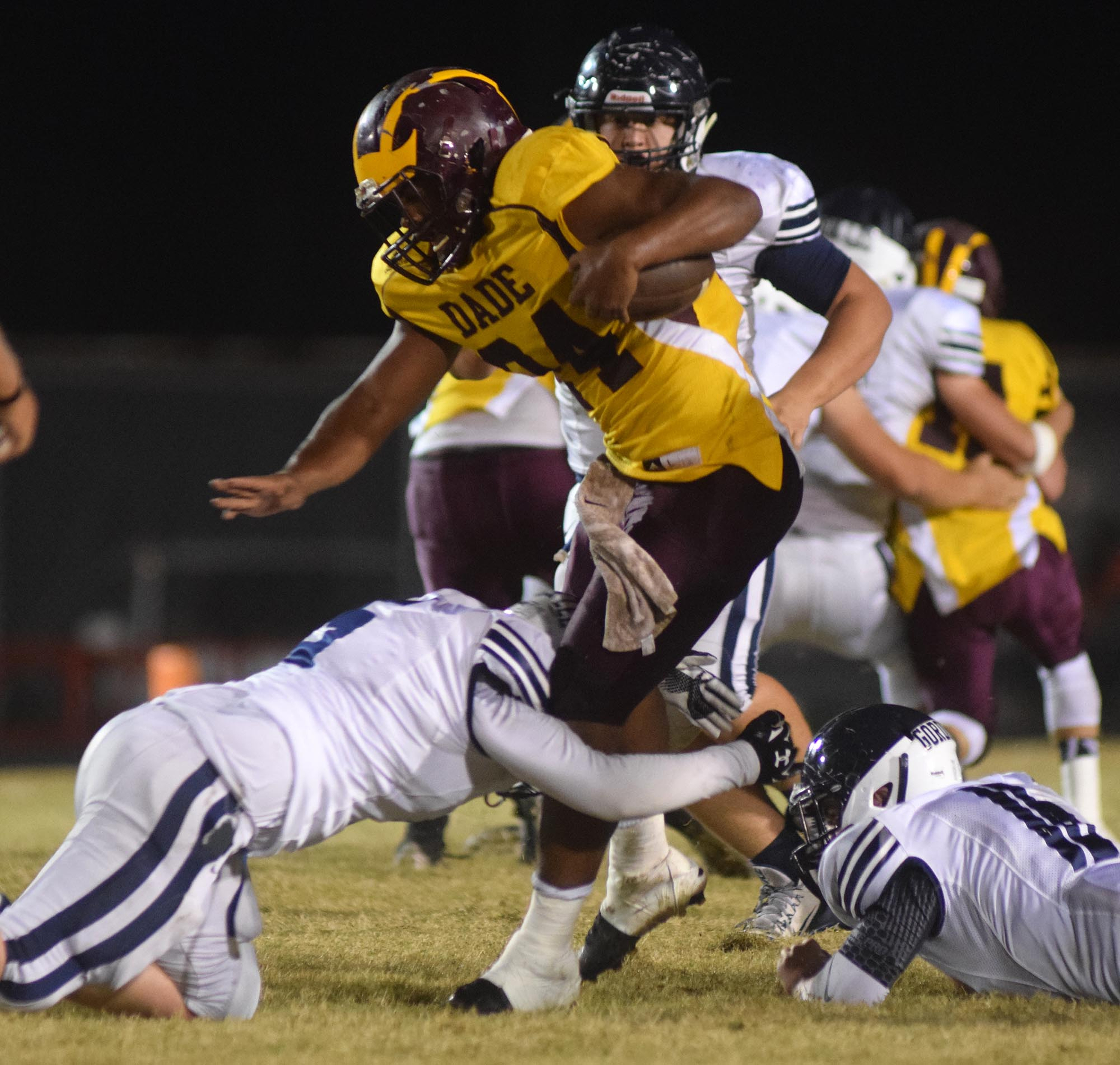 Dade County's Teddy Cole (24) is tackled by the Trojans after a long Wolverine gain.  The Gordon Lee Trojans visited the Dade County Wolverines in GHSA football action Thursday night, November 5, 2015.