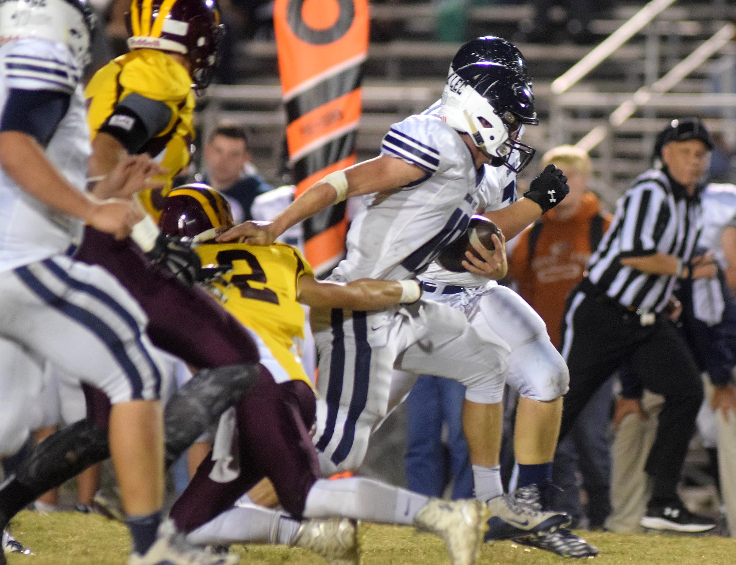 Gordon Lee quarterback Caleb O'Neal (10) breaks up the middle for a long gain.  The Gordon Lee Trojans visited the Dade County Wolverines in GHSA football action Thursday night, November 5, 2015.