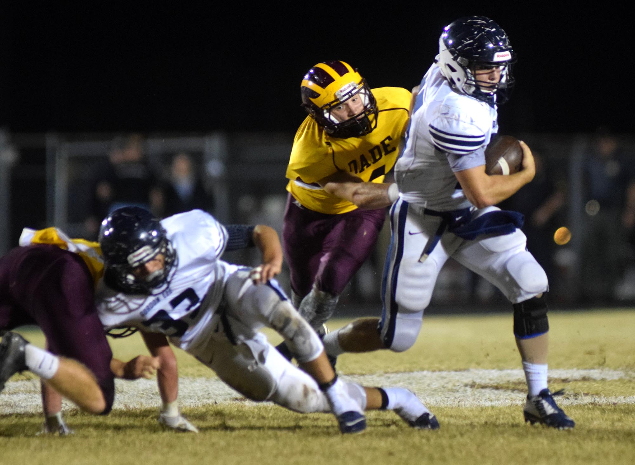 Gordon Lee's Andrew Towns (35) gets outside behind the block of Drew Cobb (33).  The Gordon Lee Trojans visited the Dade County Wolverines in GHSA football action Thursday night, November 5, 2015.