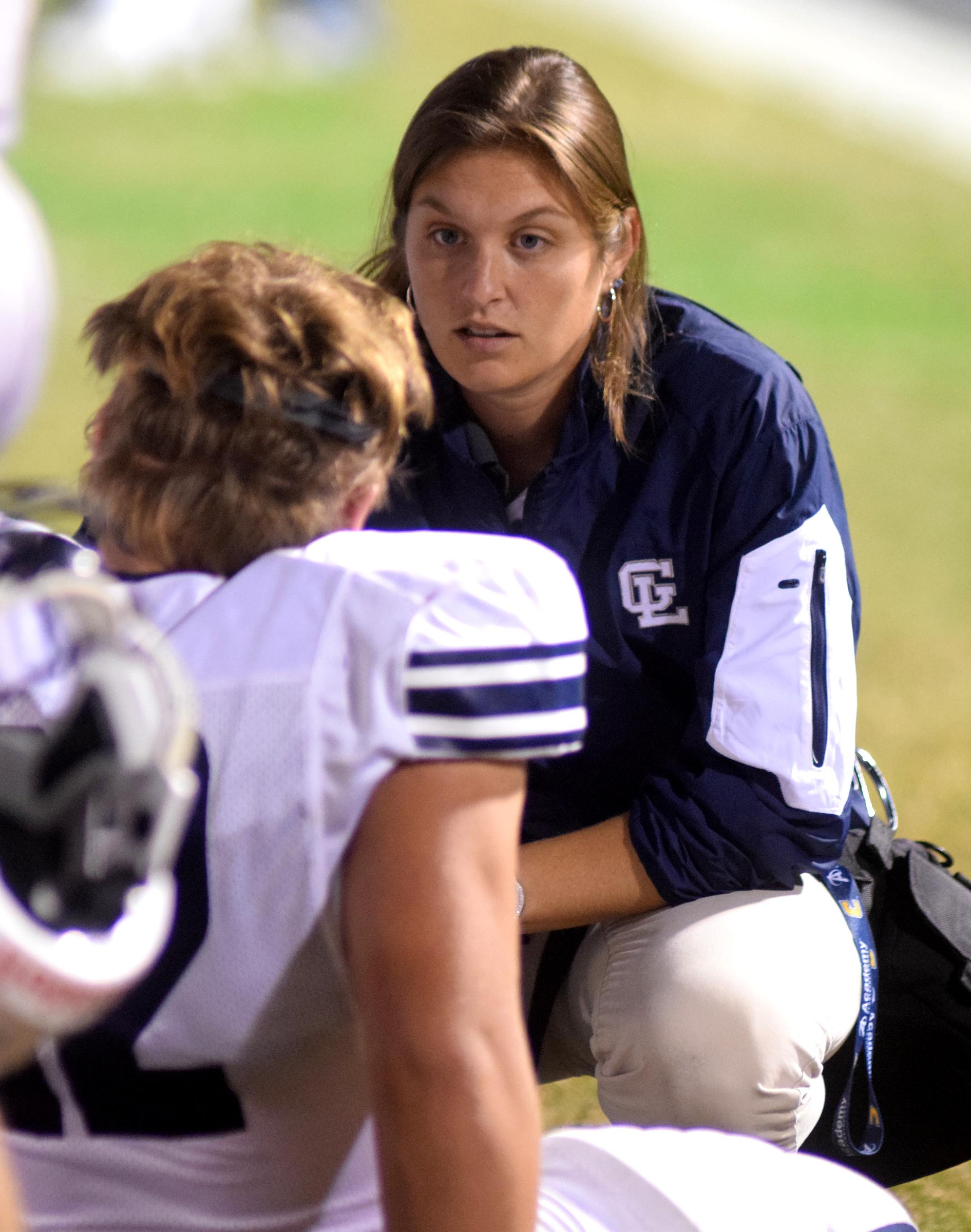 A Gordon Lee trainer checks on a injured Trojan.  The Gordon Lee Trojans visited the Dade County Wolverines in GHSA football action Thursday night, November 5, 2015.