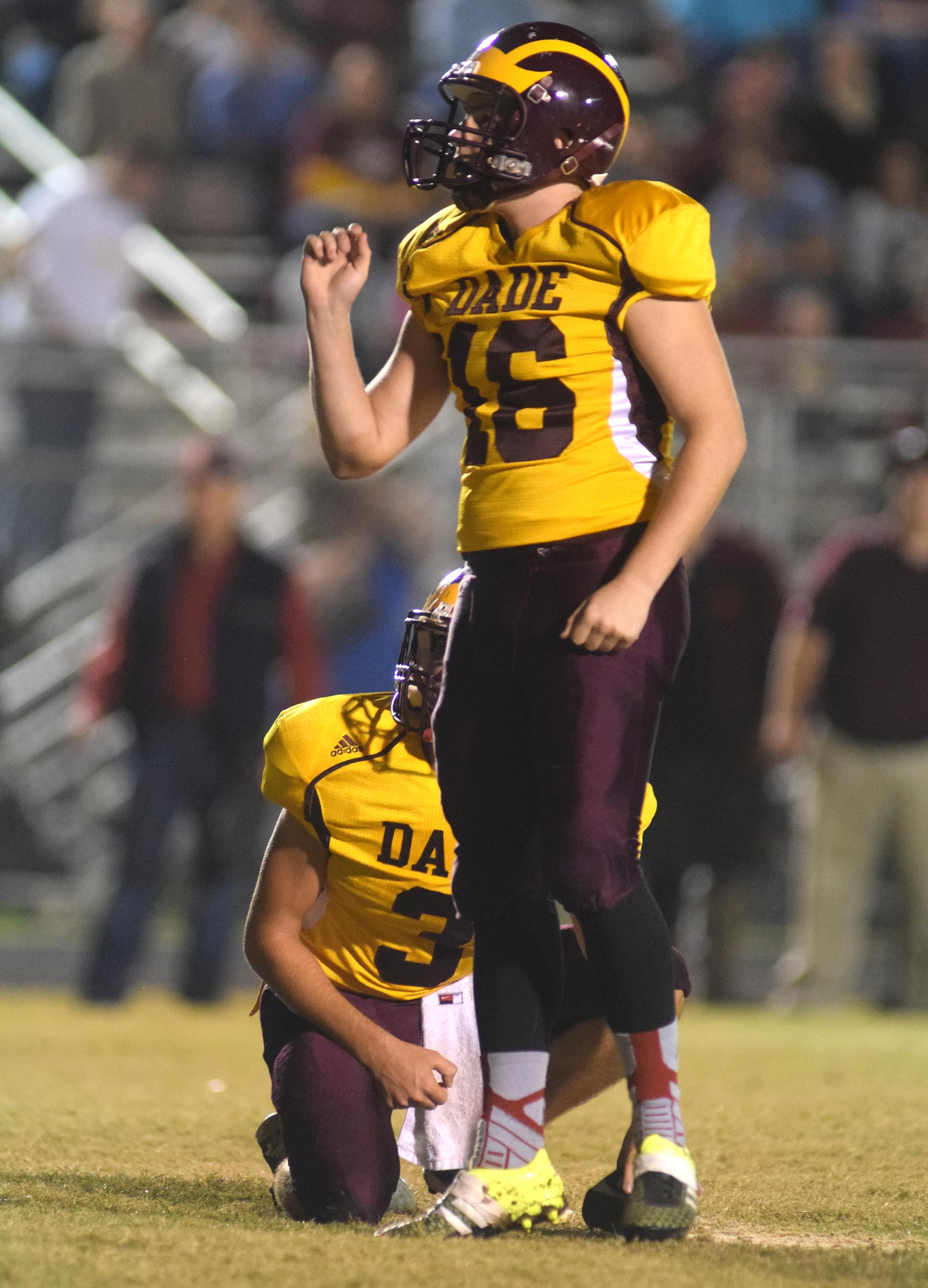 Dade County placekicker Zach Liner (16) watches as his kick goes through the uprights for a Wolverine extra point.  The Gordon Lee Trojans visited the Dade County Wolverines in GHSA football action Thursday night, November 5, 2015.