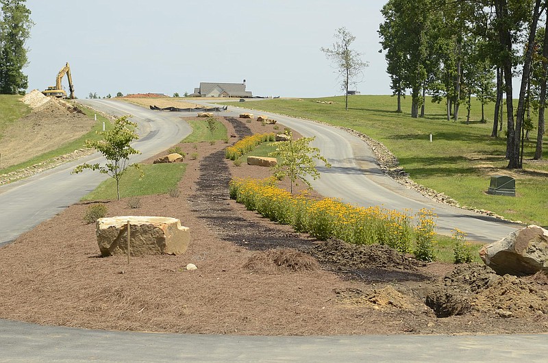 Some of the landscaping has been installed as construction continues at the Jasper Highlands subdivision atop Jasper Mountain in Marion County on Wednesday, July 30, 2014, near Kimball, Tenn.