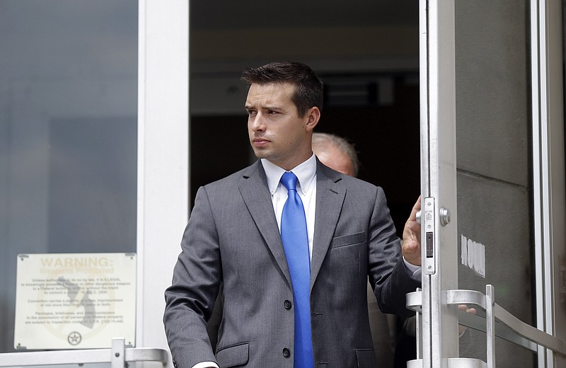 
              In a Wednesday, Sept. 9, 2015 file photo, former Madison, Ala., police officer Eric Sloan Parker walks out of the federal courthouse, in Huntsville, Ala.  A second jury deadlocked Wednesday, Nov. 4, 2015, and a judge declared another mistrial Wednesday in the case of Parker, charged with using excessive force against an Indian man.  (AP Photo/Brynn Anderson, File)
            