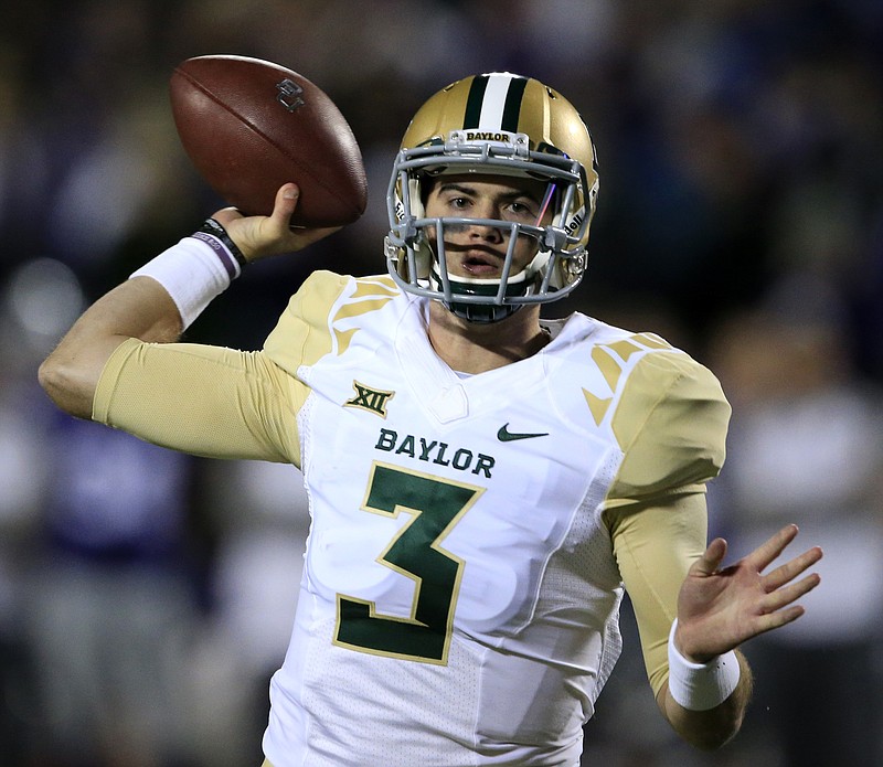 
              Baylor quarterback Jarrett Stidham (3) passes to a teammate during the first half of an NCAA college football game against Kansas State in Manhattan, Kan., Thursday, Nov. 5, 2015. (AP Photo/Orlin Wagner)
            