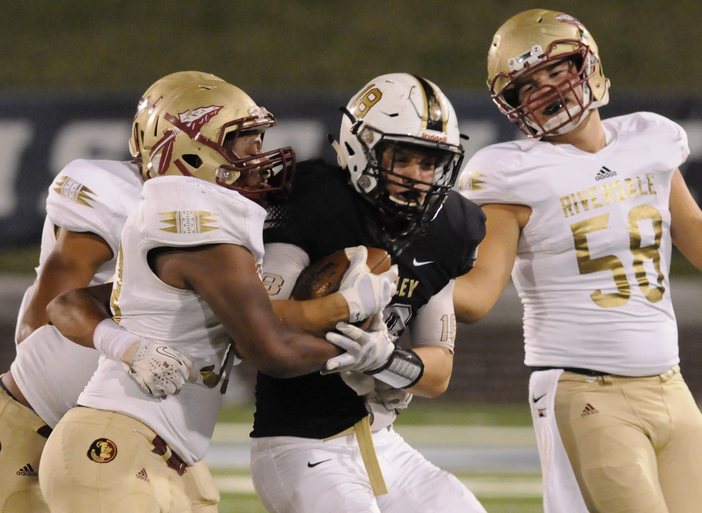 Bradley Central's  Tyler Carpenter is hit following a pass reception for good yardage in first half action in the class 6A first-round prep football playoff game at Finley Stadium Thursday night.