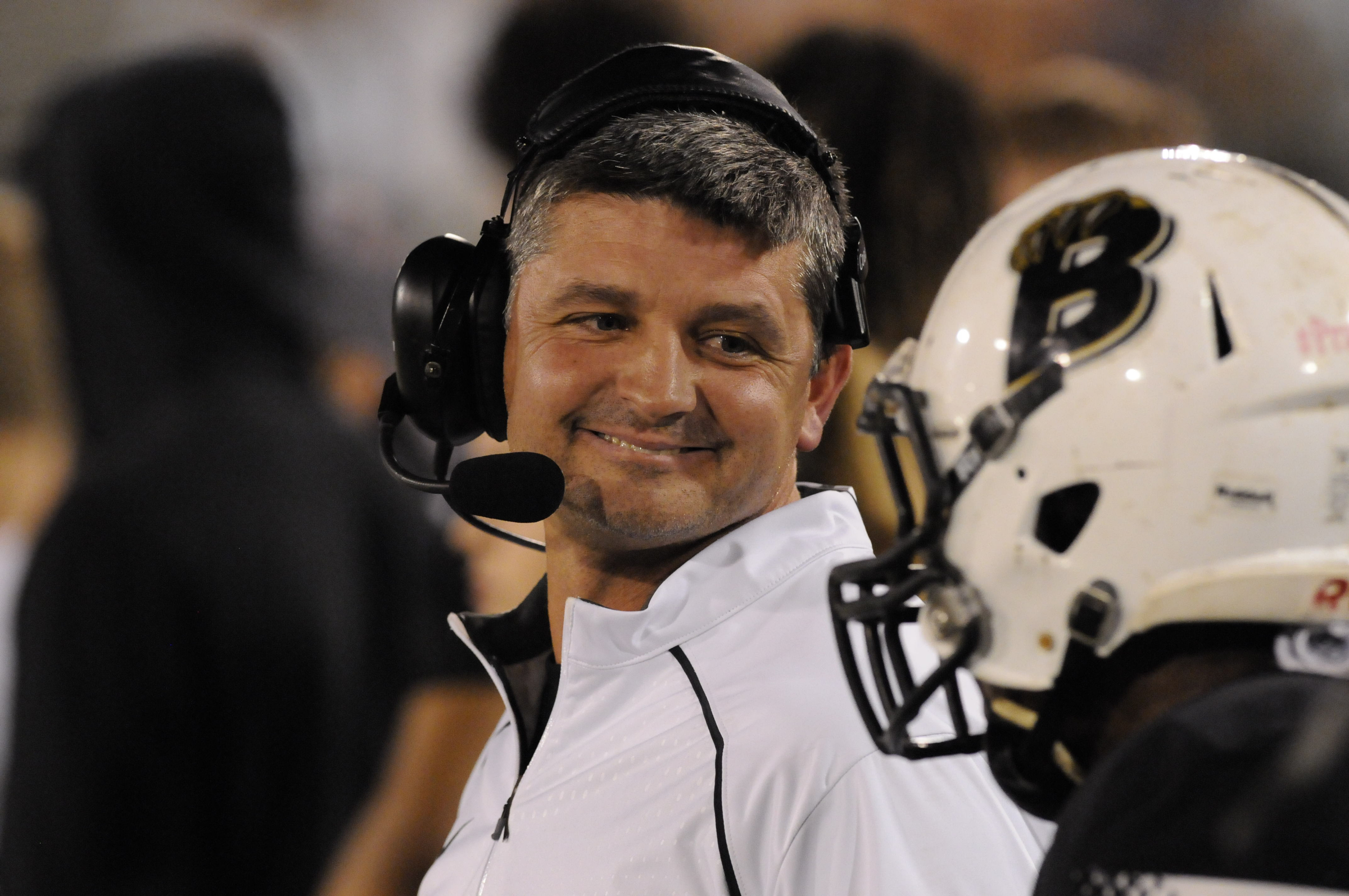 Bradley Central coach Damon Floyd breaks into a smile with Courtland Bradley after a first half score in the class 6A first-round prep football playoff game at Finley Stadium Thursday night.
