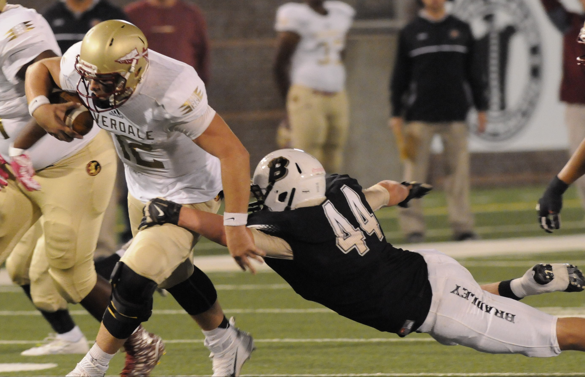 Riverdale quarterback Brandon Be a (12) is caught by Bradley Central's Kevin Gentry (44) in first half action Thursday night at Finley Stadium.
