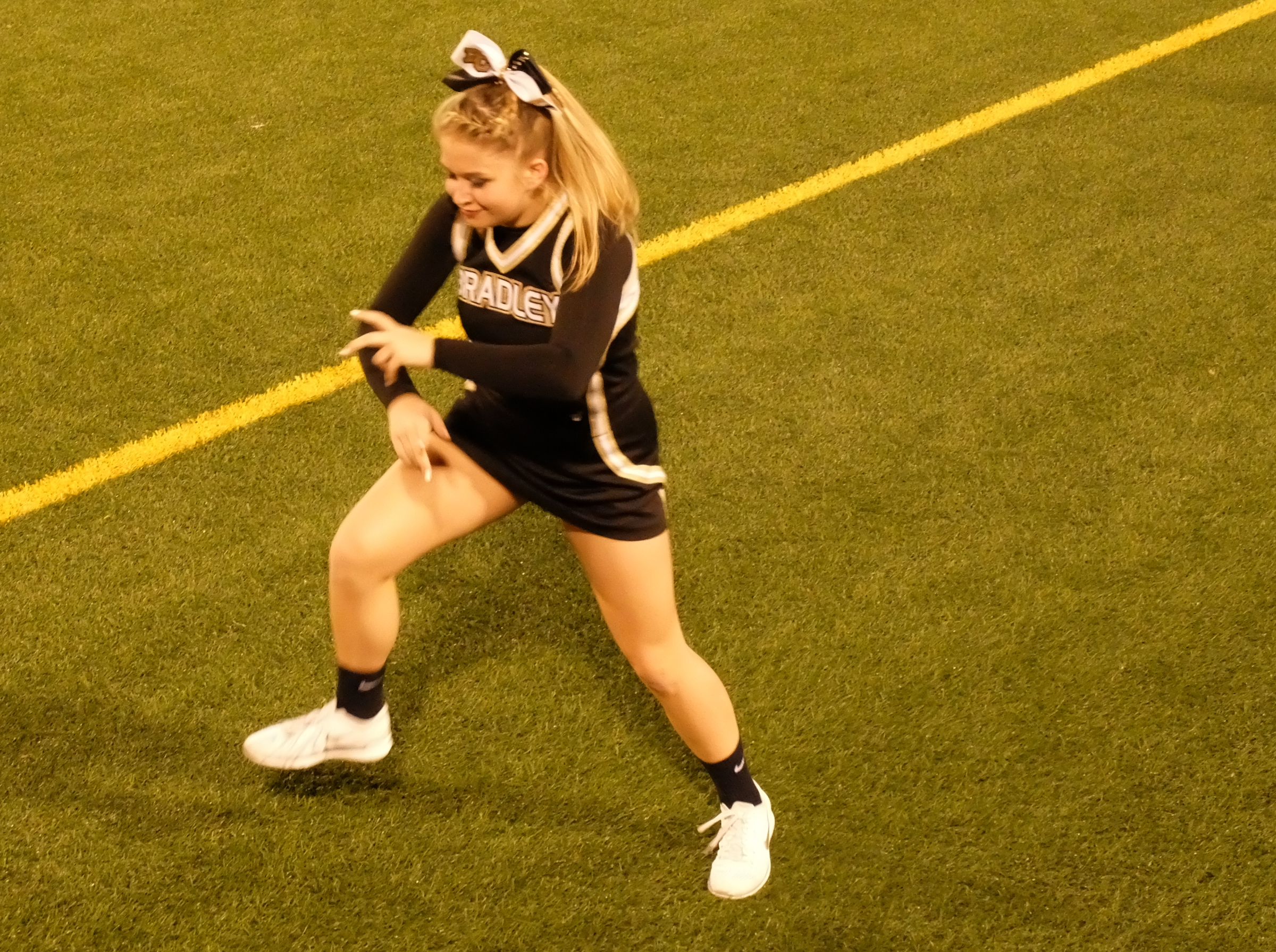 Bradley Central cheerleader Mikahla Gay does an original dance "Lose Yourself" as a warmup before the start of the class 6A first-round prep football playoff game against Riverdale at Finley Stadium Thursday night.