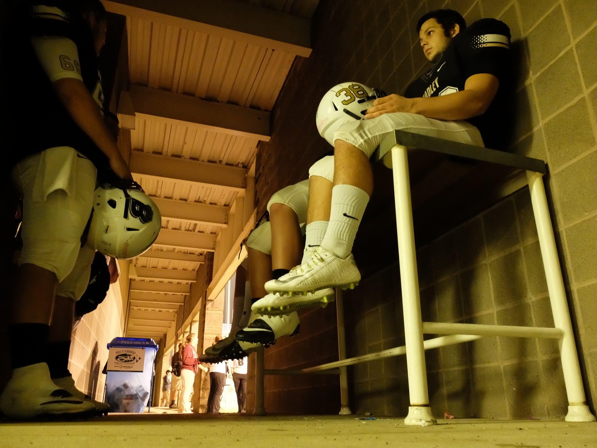Bradley Central's Hunter Duggan sits quietly minutes before game time just outside the locker room before the start of the class 6A first-round prep football playoff game with Riverdale at Finley Stadium.