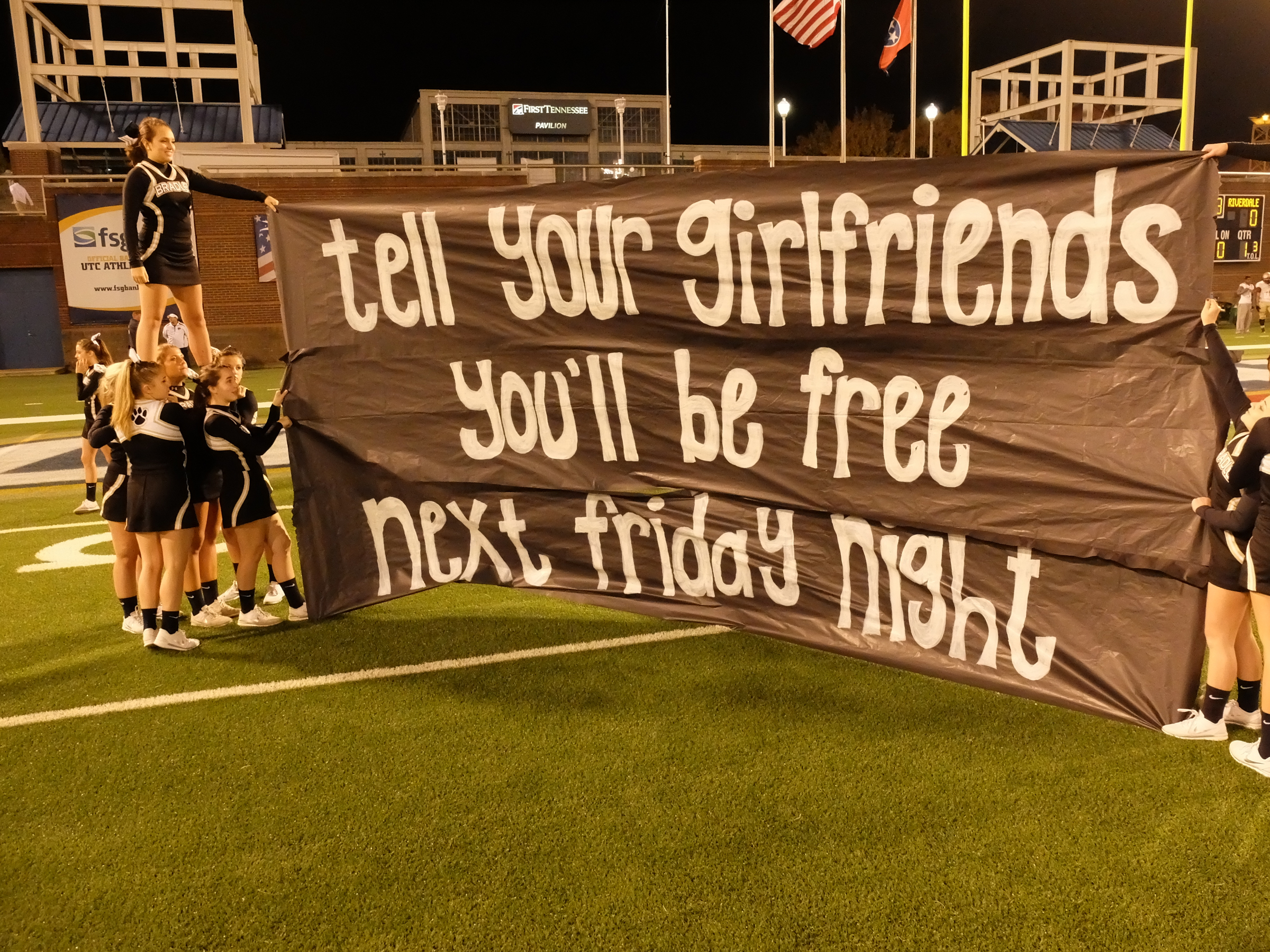 Bradley Central cheerleaders hold a message for the Riverdale team before the game at Finley Stadium Thursday night.