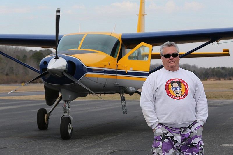 Justin Silvia, 52, the owner of Chattanooga Skydiving Company, poses for a portrait in front of a plane he uses to take up skydivers at the Marion County Airport on Friday, February 28, 2014, in Jasper, Tenn. Silvia has been in the skydiving business for 30 years.