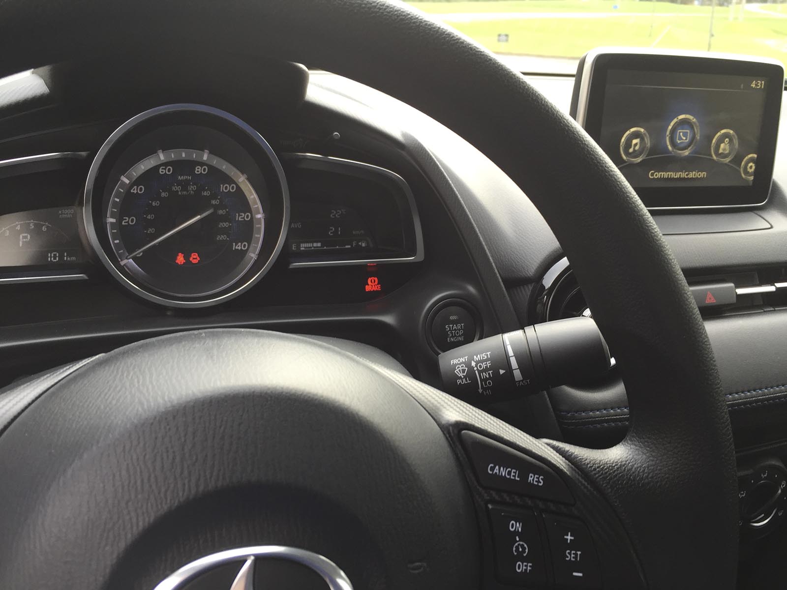 The speedometer is flanked by a digital tachometer.