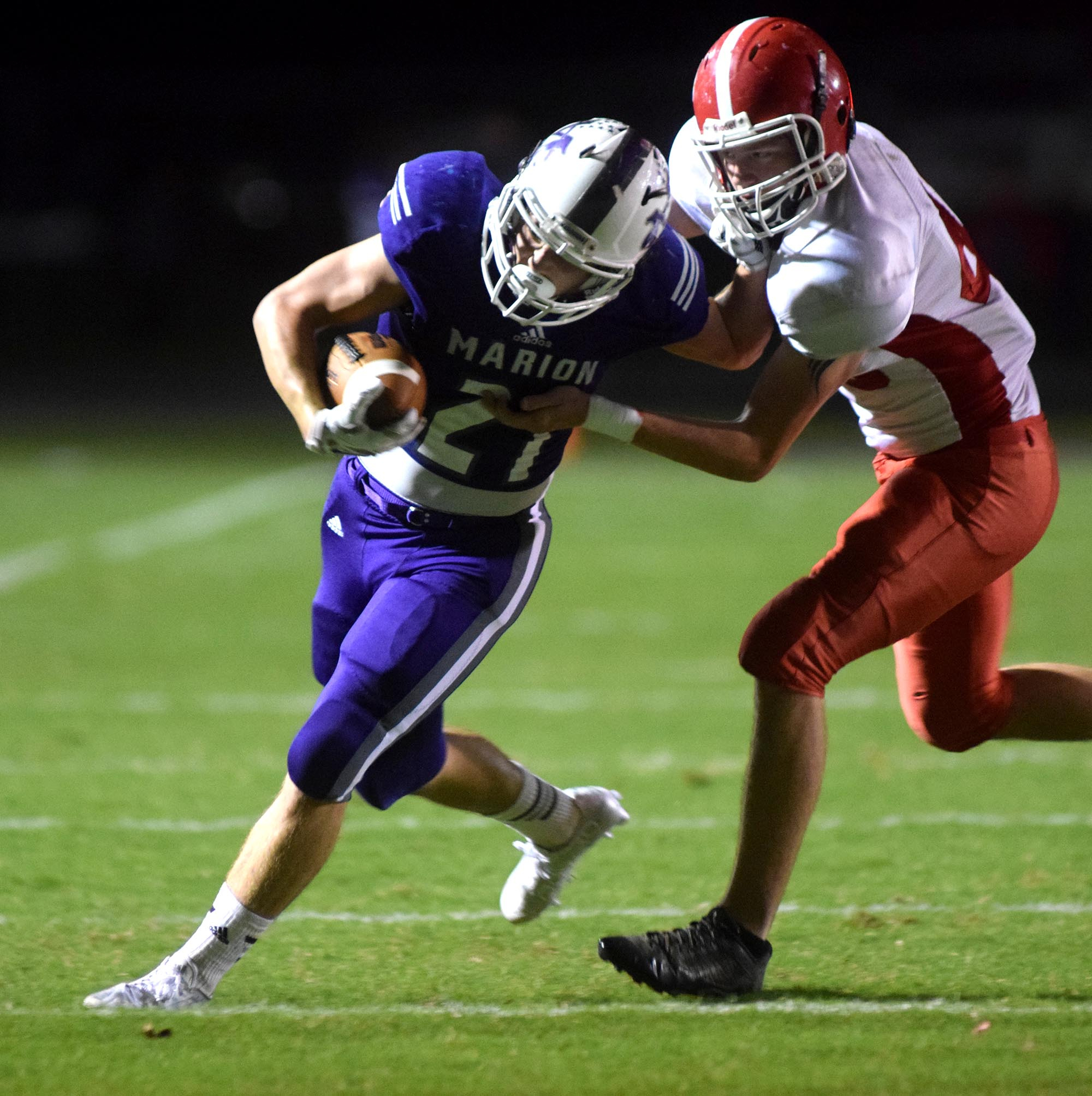 Maron County's Josh Henderson (21) rushes around the left side.  The Westmoreland Eagles visited the Marion County Warriors in the first round of the TSSAA football playoffs Friday night, November 6, 2015.