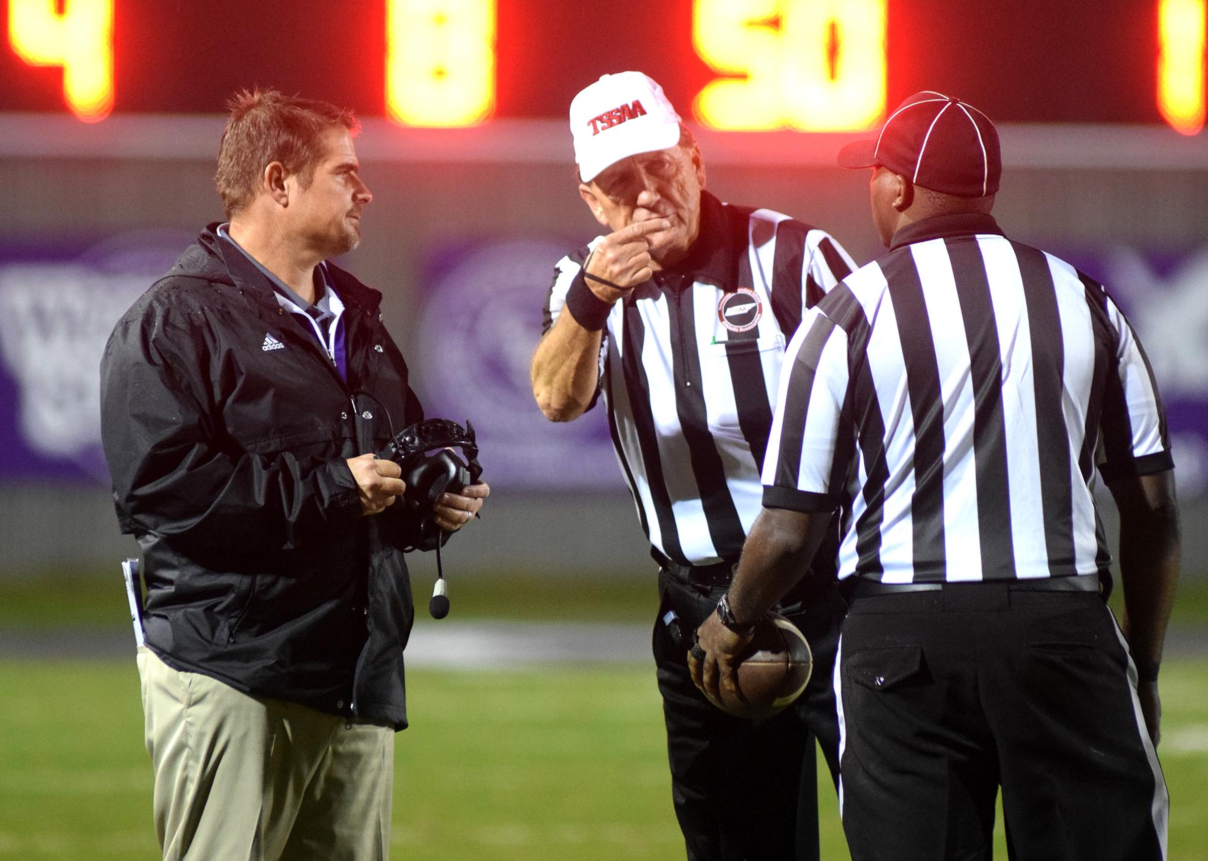 Marion County head coach Ricky Ross has a conference with the officials.  The Westmoreland Eagles visited the Marion County Warriors in the first round of the TSSAA football playoffs Friday night, November 6, 2015.