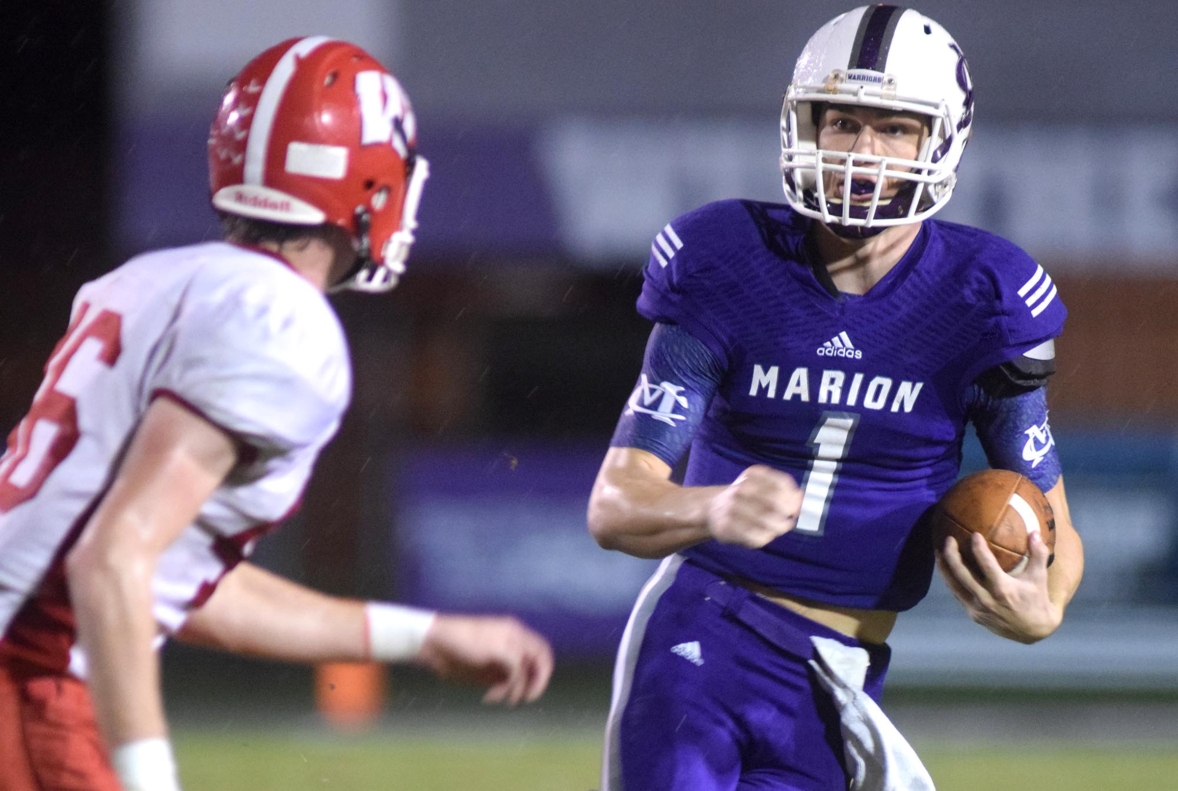 Marion County quarterback Logan Walters (1) picks up yardage around left end.  The Westmoreland Eagles visited the Marion County Warriors in the first round of the TSSAA football playoffs Friday night, November 6, 2015.