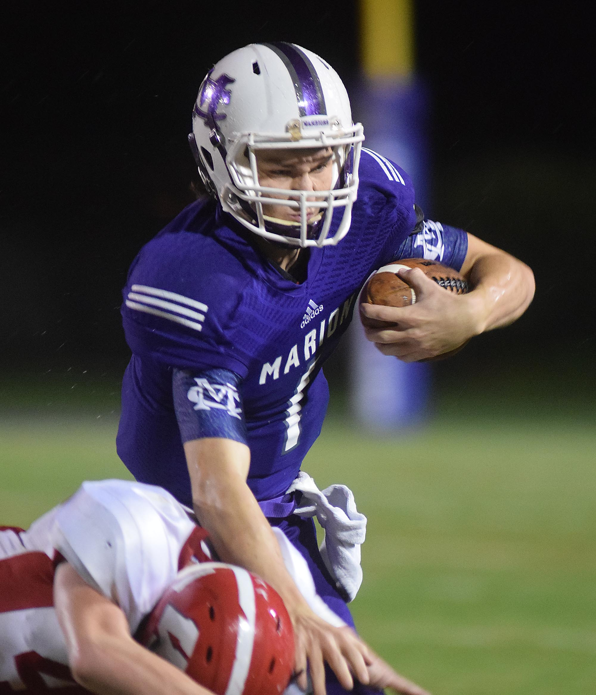Marion County quarterback Logan Walters (1) picks up a Warrior first down.  The Westmoreland Eagles visited the Marion County Warriors in the first round of the TSSAA football playoffs Friday night, November 6, 2015.