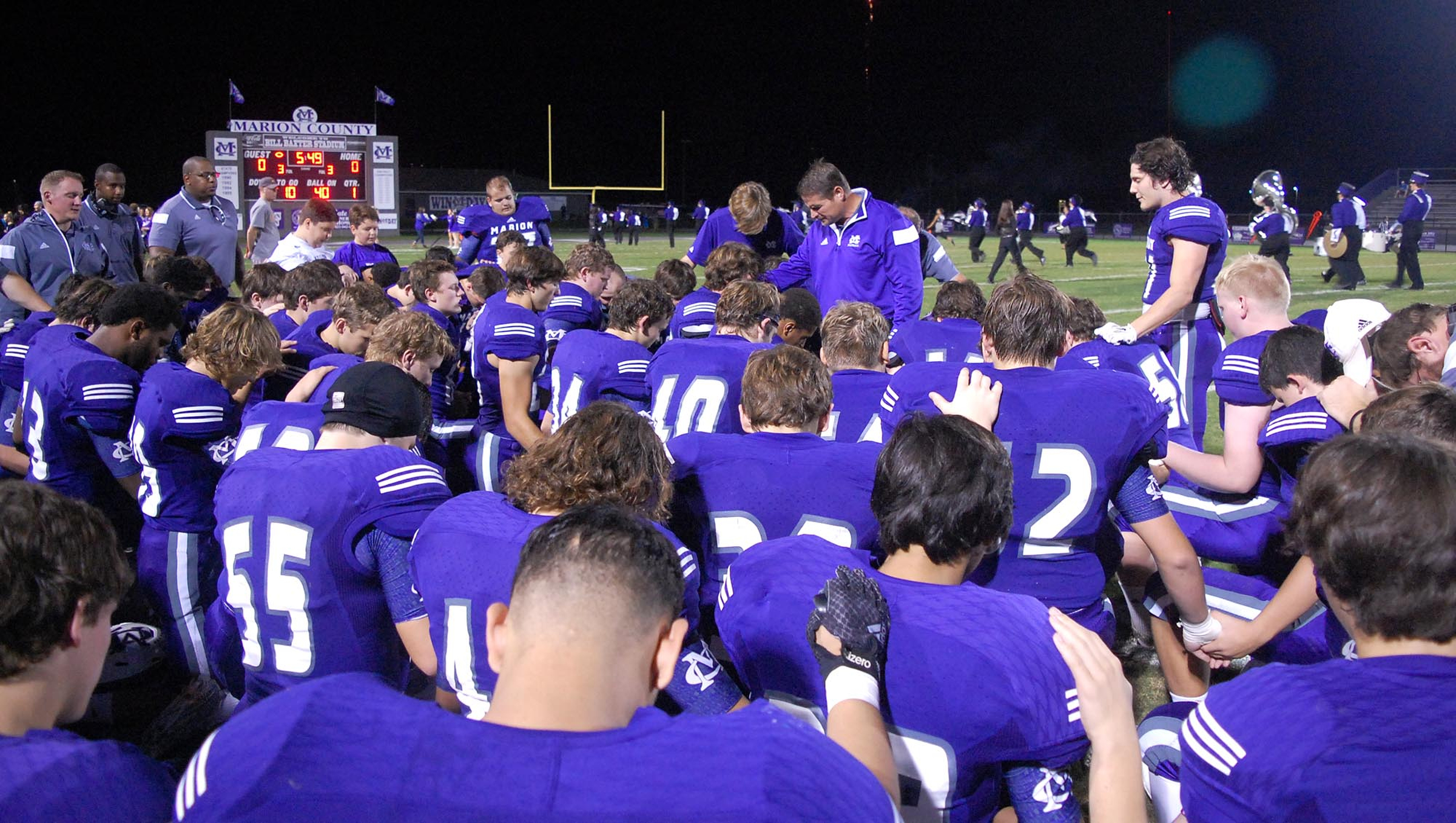The Marion County Warriors take a knee for prayer before the game.  The Westmoreland Eagles visited the Marion County Warriors in the first round of the TSSAA football playoffs Friday night, November 6, 2015.