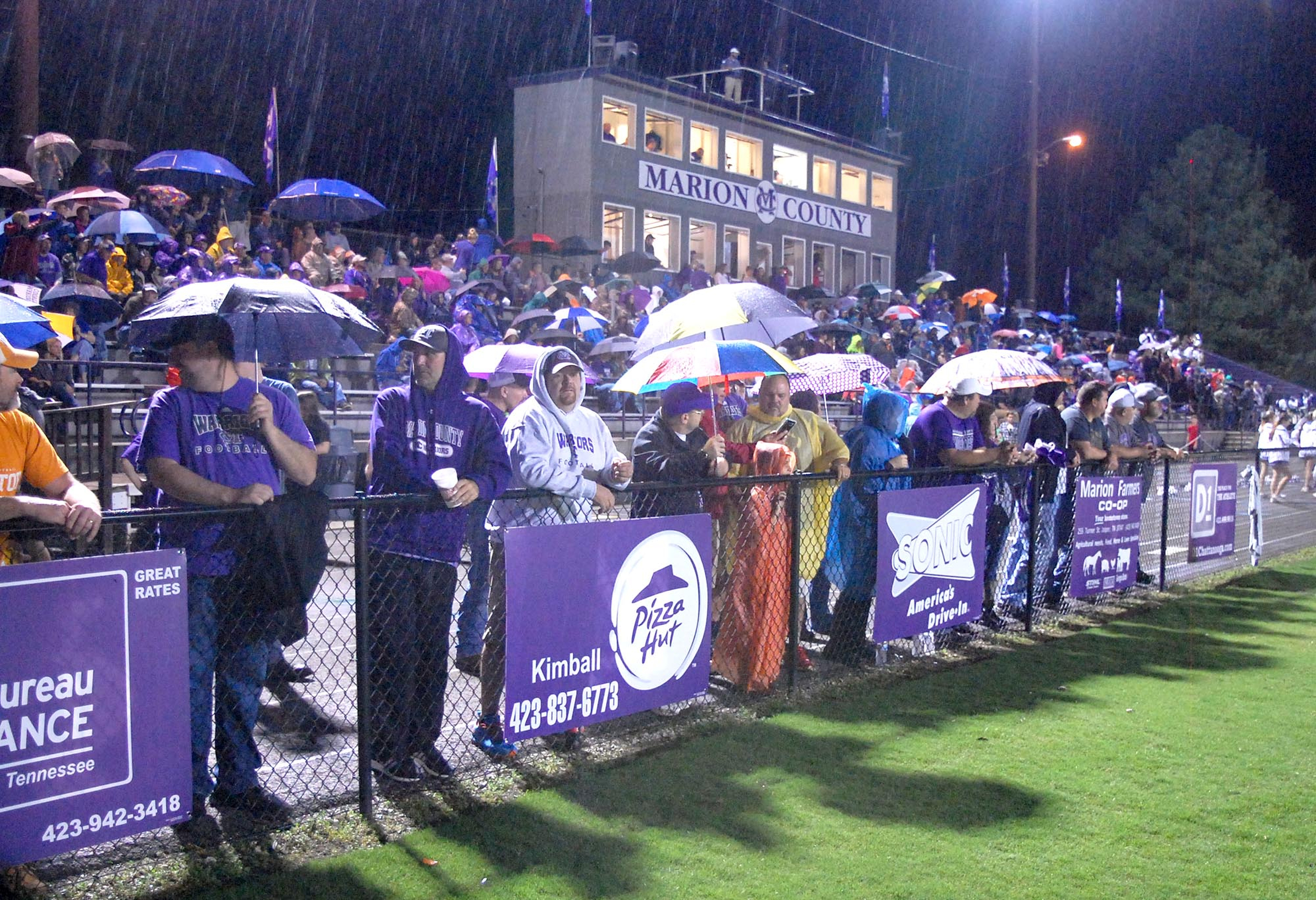 Umbrella come out as the rain starts in the first half.  The Westmoreland Eagles visited the Marion County Warriors in the first round of the TSSAA football playoffs Friday night, November 6, 2015.