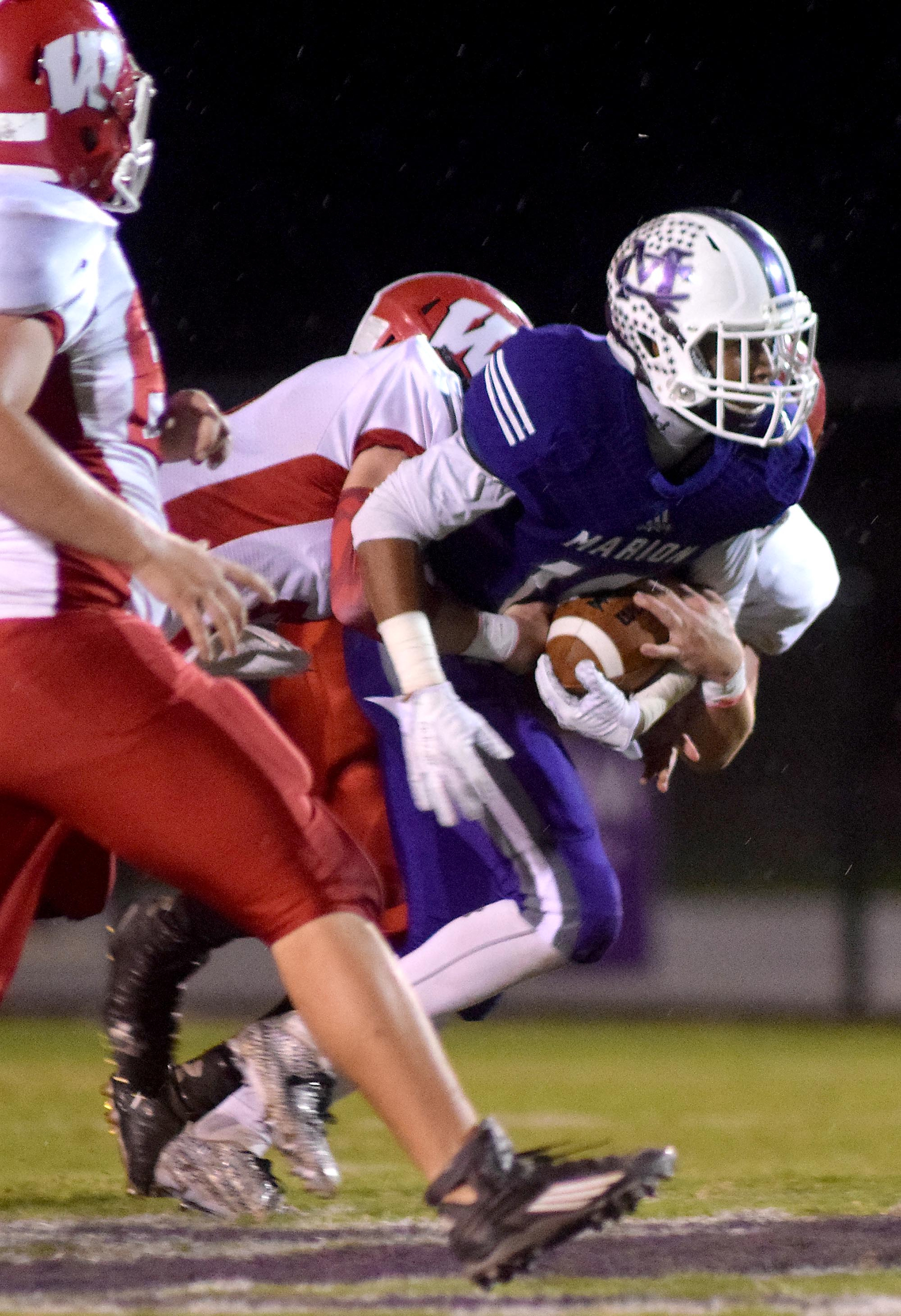 Marion County's Quinn Beasley (16) is brought down after a pass reception.  The Westmoreland Eagles visited the Marion County Warriors in the first round of the TSSAA football playoffs Friday night, November 6, 2015.