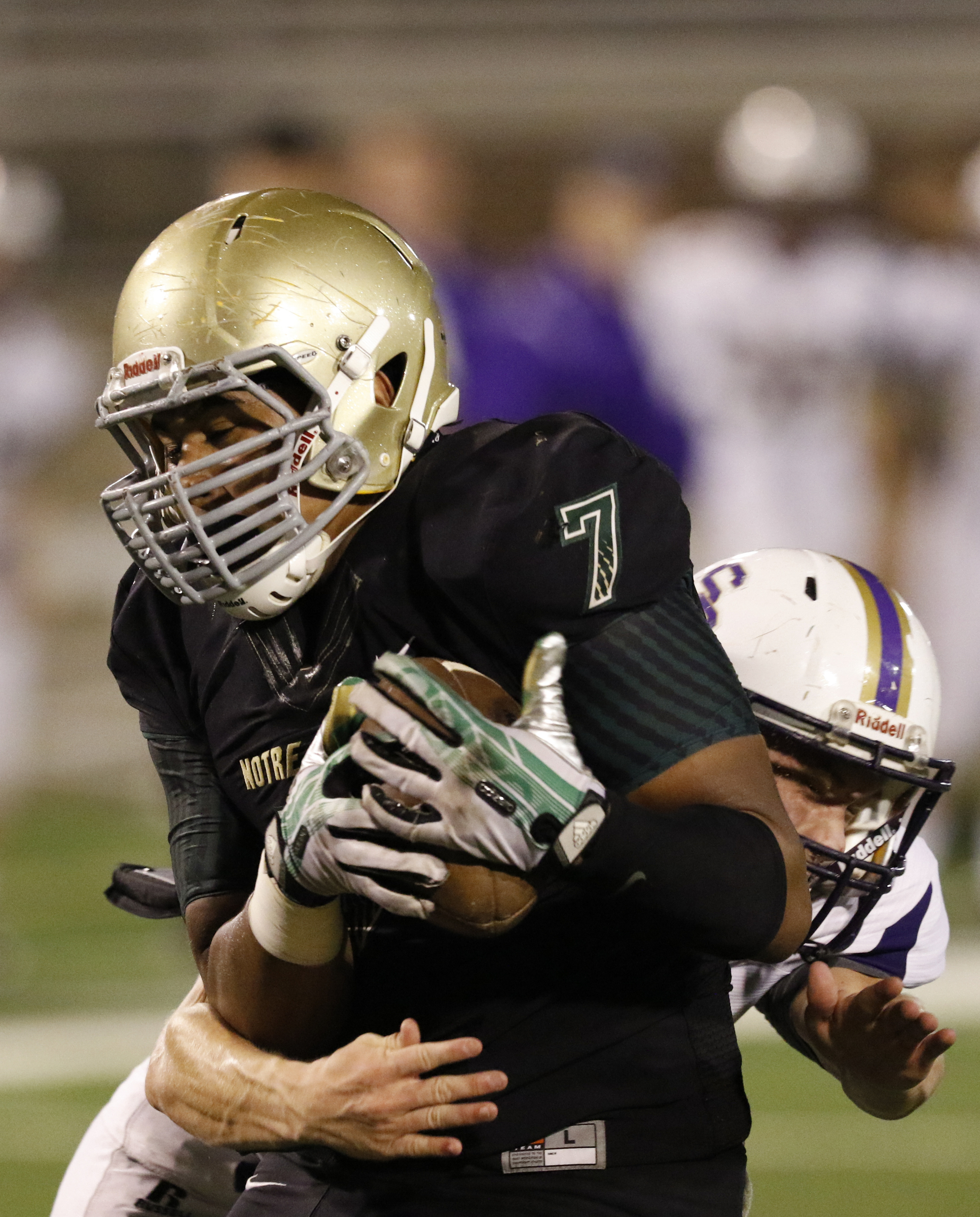 Staff Photo by Dan Henry / The Chattanooga Times Free Press- 11/6/15. Sequatchie County's Colby Reed (17) tackles Notre Dame High School's Patrick Johnson (7) moments after he completed a first down yardage catch during the first half of play at Finley Stadium in downtown Chattanooga on Friday.