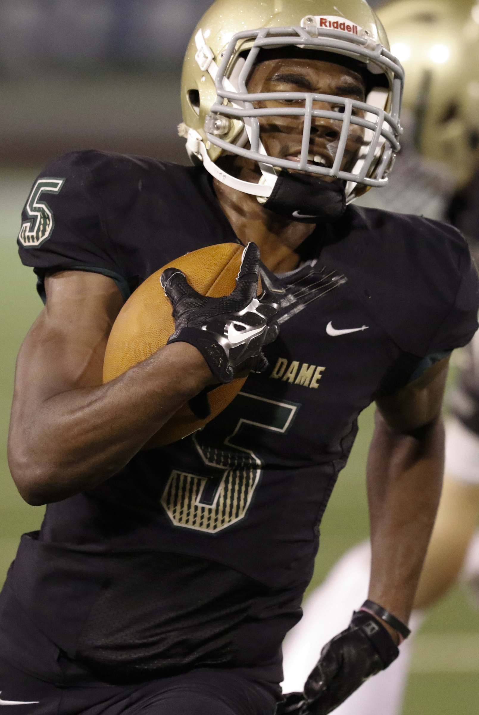 Notre Dame High School's Ricky Ballard (5) runs the ball in for a touchdown against Sequatchie County during the first half of play at Finley Stadium in downtown Chattanooga on Friday.