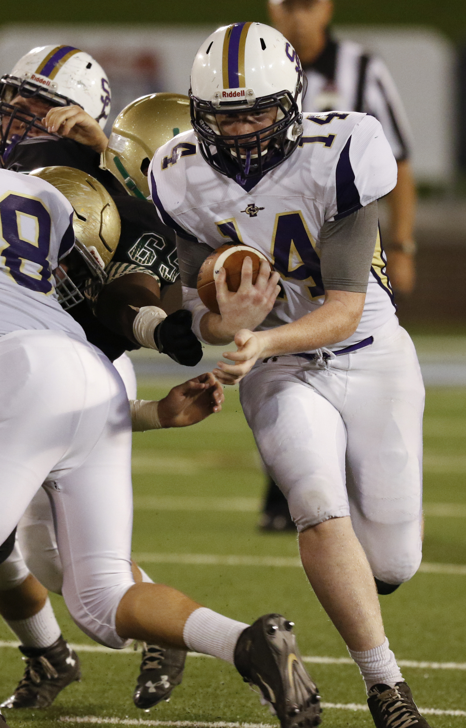 Staff Photo by Dan Henry / The Chattanooga Times Free Press- 11/6/15. Sequatchie County's Ethan Barker runs the ball past the Notre Dame High School defensive line at Finley Stadium in downtown Chattanooga on Friday.